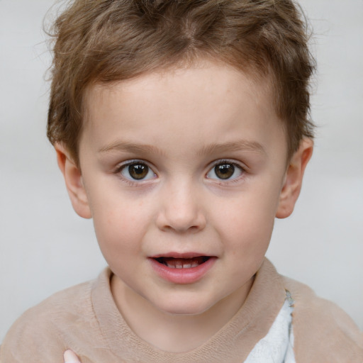 Joyful white child male with short  brown hair and brown eyes