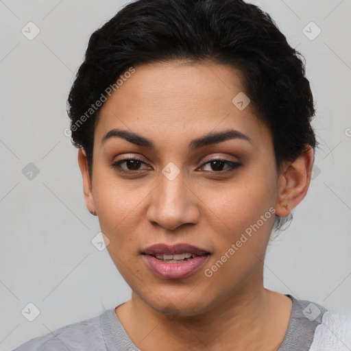 Joyful latino young-adult female with short  black hair and brown eyes