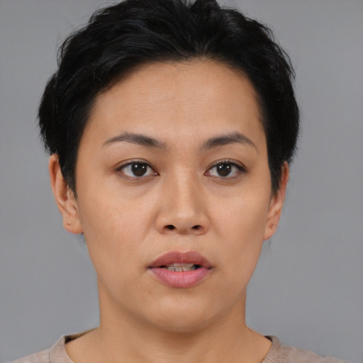 Neutral asian young-adult female with short  black hair and brown eyes