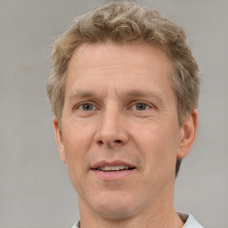 Joyful white adult male with short  brown hair and grey eyes