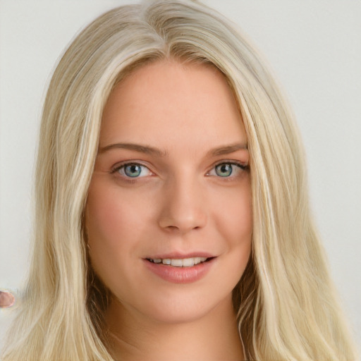 Joyful white young-adult female with long  brown hair and blue eyes