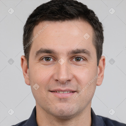 Joyful white young-adult male with short  brown hair and brown eyes