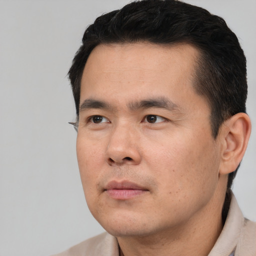 Neutral asian young-adult male with short  black hair and brown eyes