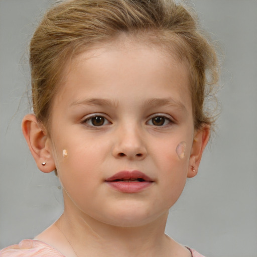 Joyful white child female with short  brown hair and brown eyes