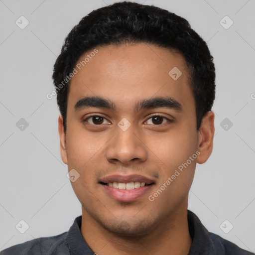 Joyful latino young-adult male with short  black hair and brown eyes