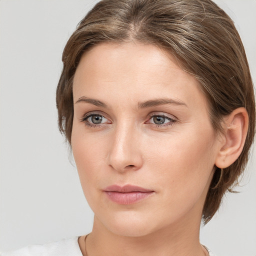 Neutral white young-adult female with medium  brown hair and grey eyes