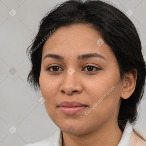 Joyful latino young-adult female with medium  brown hair and brown eyes