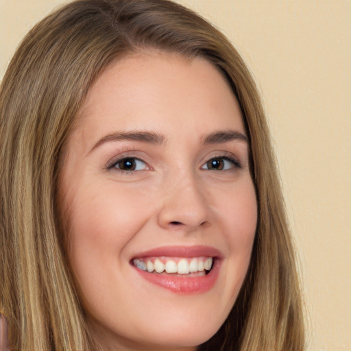 Joyful white young-adult female with long  brown hair and brown eyes