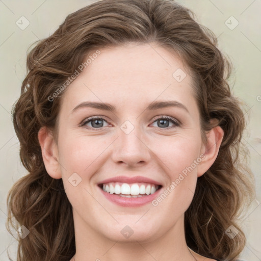 Joyful white young-adult female with medium  brown hair and green eyes