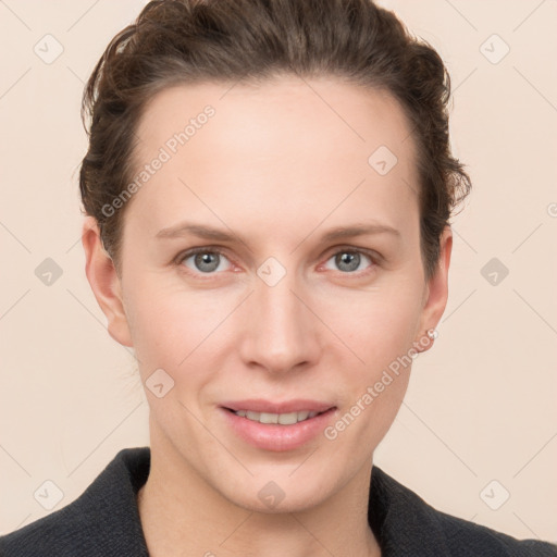 Joyful white young-adult female with short  brown hair and grey eyes