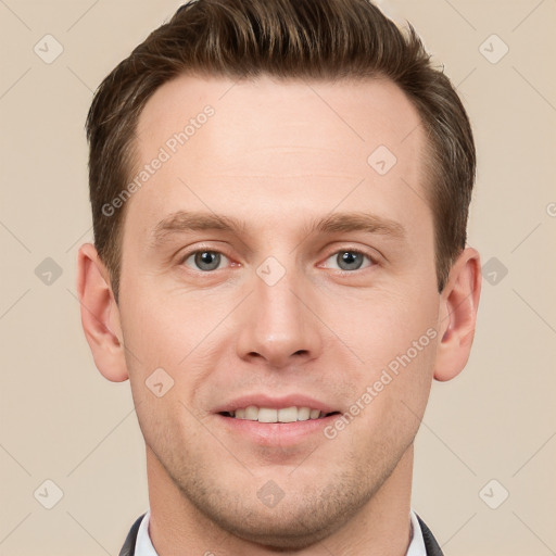 Joyful white young-adult male with short  brown hair and grey eyes