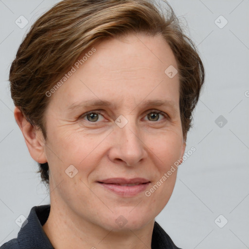 Joyful white adult female with short  brown hair and grey eyes