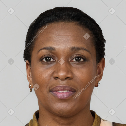 Joyful black adult female with short  brown hair and brown eyes