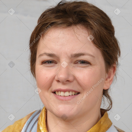 Joyful white adult female with medium  brown hair and blue eyes