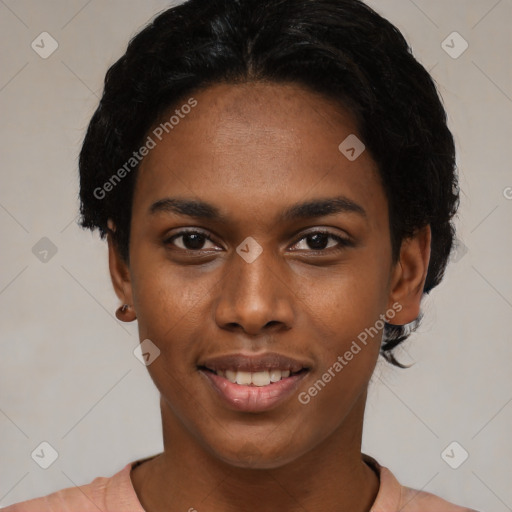 Joyful black young-adult female with short  black hair and brown eyes