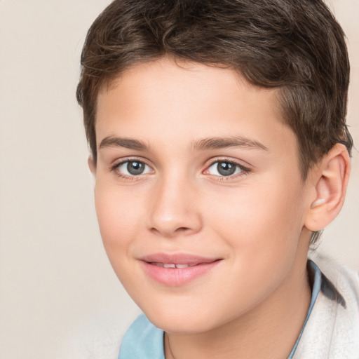 Joyful white child male with short  brown hair and brown eyes