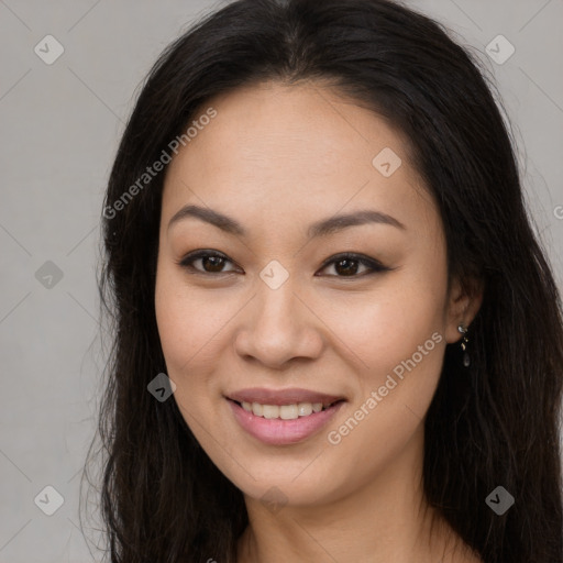 Joyful asian young-adult female with long  brown hair and brown eyes