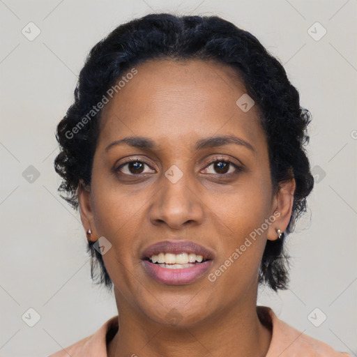 Joyful black adult female with short  black hair and brown eyes