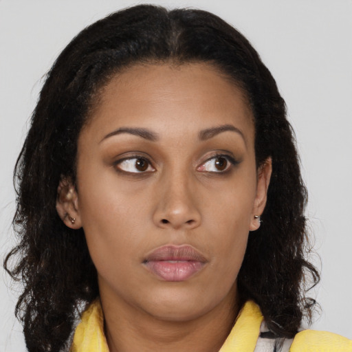 Neutral black young-adult female with long  brown hair and brown eyes