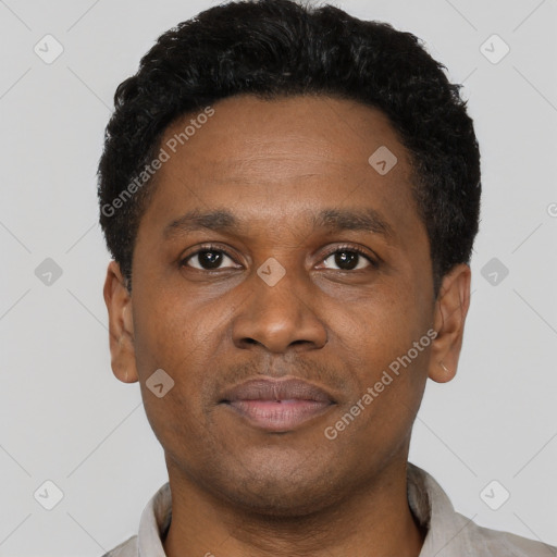 Neutral latino young-adult male with short  brown hair and brown eyes