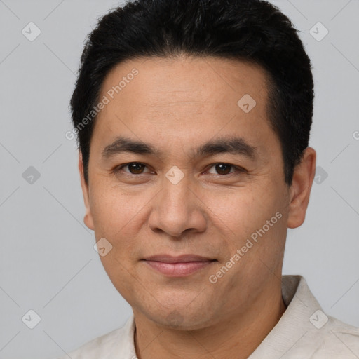 Joyful white young-adult male with short  black hair and brown eyes