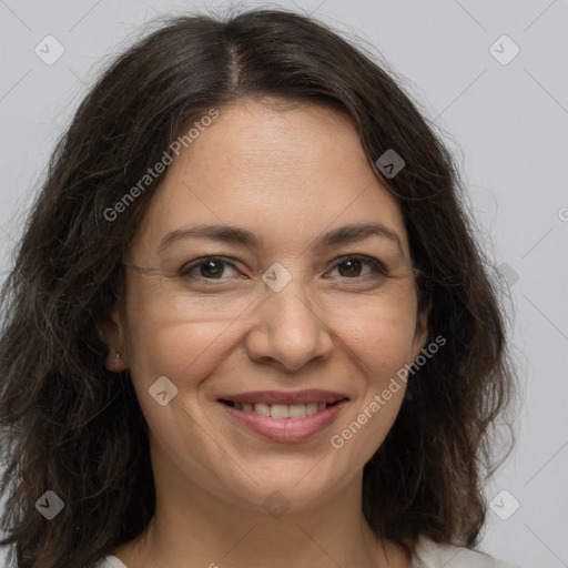 Joyful white adult female with medium  brown hair and brown eyes