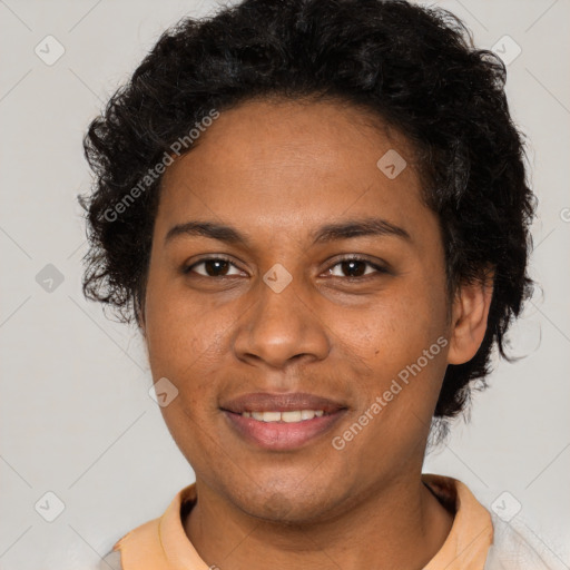 Joyful black adult female with short  brown hair and brown eyes