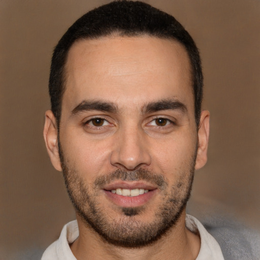 Joyful white young-adult male with short  brown hair and brown eyes