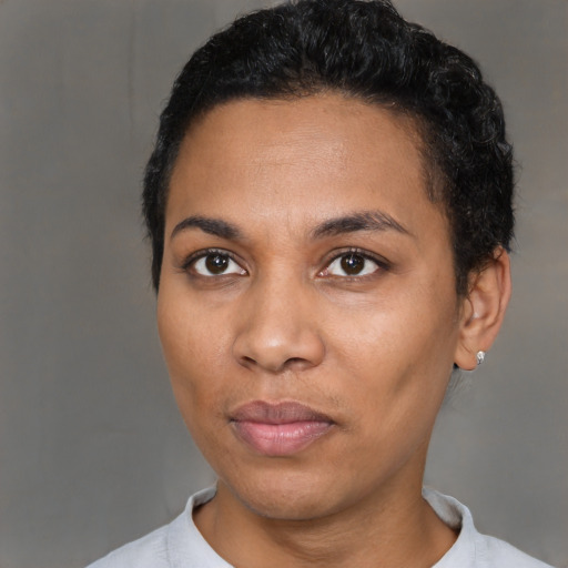 Neutral black young-adult female with short  black hair and brown eyes