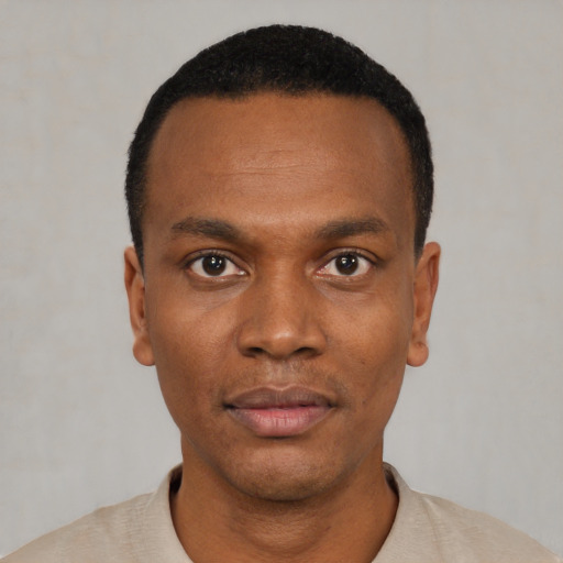 Neutral black young-adult male with short  black hair and brown eyes