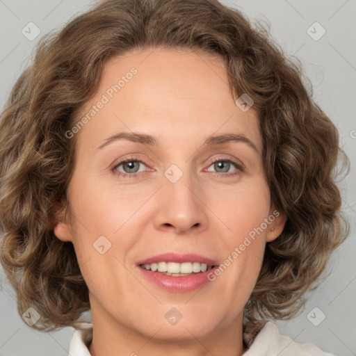 Joyful white adult female with medium  brown hair and green eyes