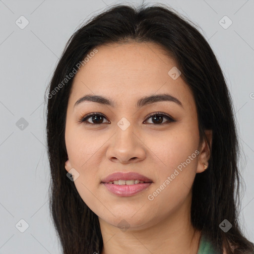 Joyful asian young-adult female with long  brown hair and brown eyes