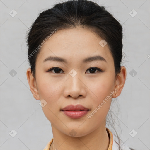 Joyful asian young-adult female with short  brown hair and brown eyes