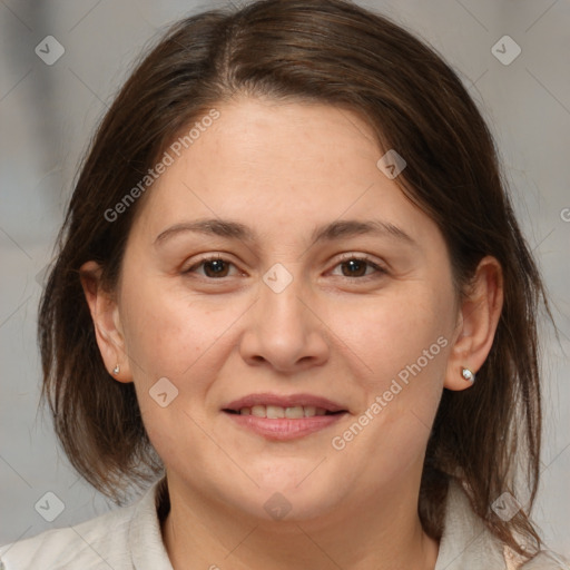 Joyful white adult female with medium  brown hair and brown eyes