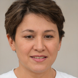 Joyful white adult female with short  brown hair and brown eyes