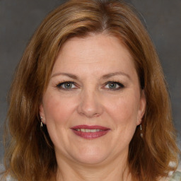 Joyful white adult female with medium  brown hair and brown eyes