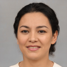 Joyful asian young-adult female with medium  brown hair and brown eyes