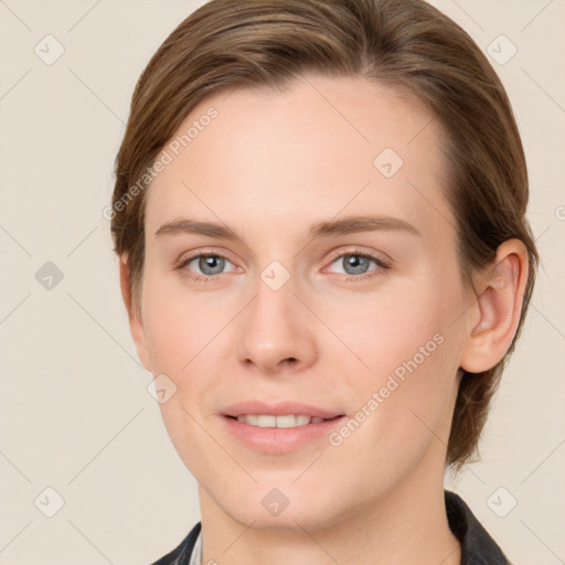 Joyful white young-adult female with medium  brown hair and grey eyes