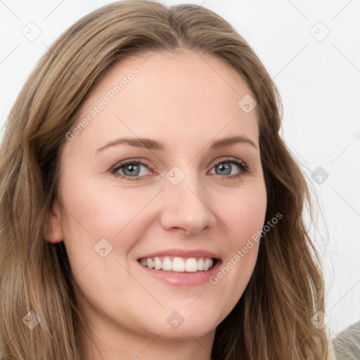 Joyful white young-adult female with long  brown hair and blue eyes