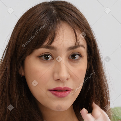 Neutral white young-adult female with long  brown hair and brown eyes