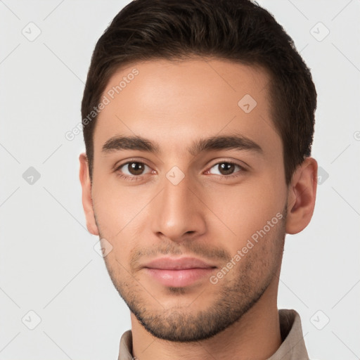 Joyful white young-adult male with short  brown hair and brown eyes