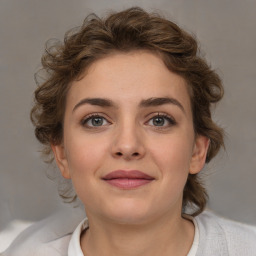 Joyful white young-adult female with medium  brown hair and blue eyes