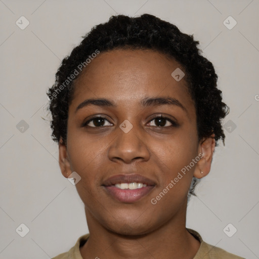 Joyful black young-adult female with short  black hair and brown eyes