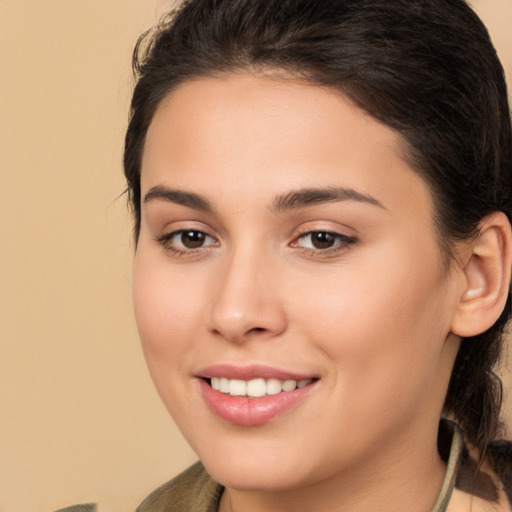 Joyful white young-adult female with long  brown hair and brown eyes