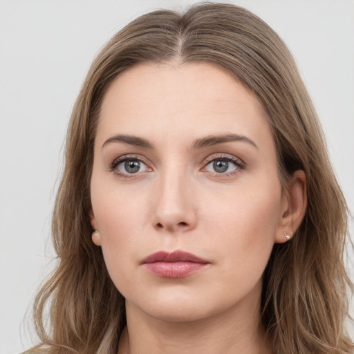 Neutral white young-adult female with long  brown hair and grey eyes