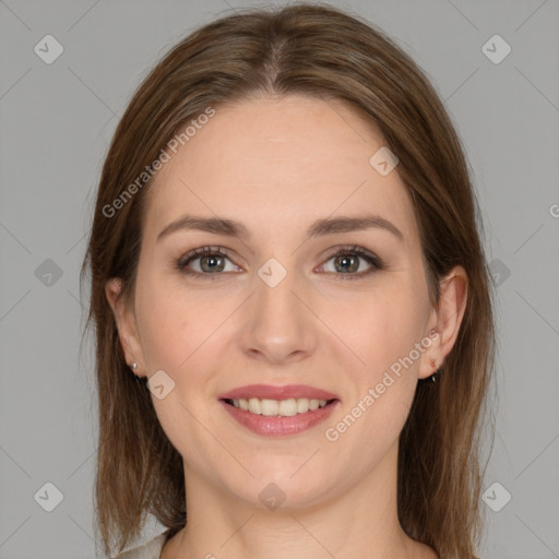 Joyful white young-adult female with medium  brown hair and grey eyes