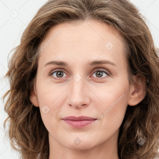 Joyful white young-adult female with long  brown hair and green eyes