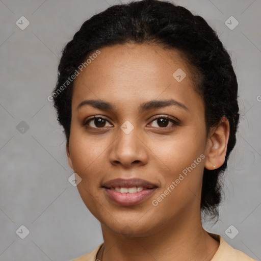 Joyful latino young-adult female with short  black hair and brown eyes