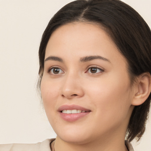 Joyful white young-adult female with medium  brown hair and brown eyes