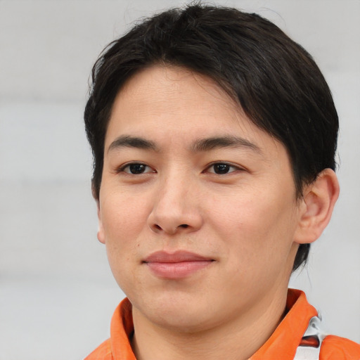 Joyful asian young-adult male with short  brown hair and brown eyes